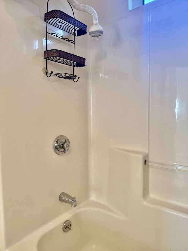 bathroom featuring  shower combination