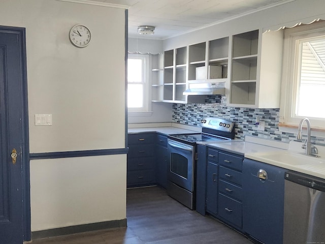 kitchen featuring blue cabinets, sink, appliances with stainless steel finishes, dark hardwood / wood-style floors, and decorative backsplash