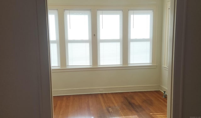 spare room featuring dark hardwood / wood-style floors