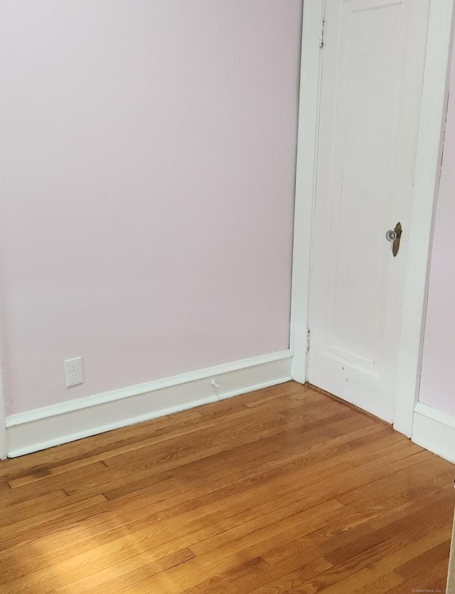 empty room featuring hardwood / wood-style flooring