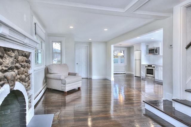 unfurnished room featuring dark hardwood / wood-style flooring and baseboard heating