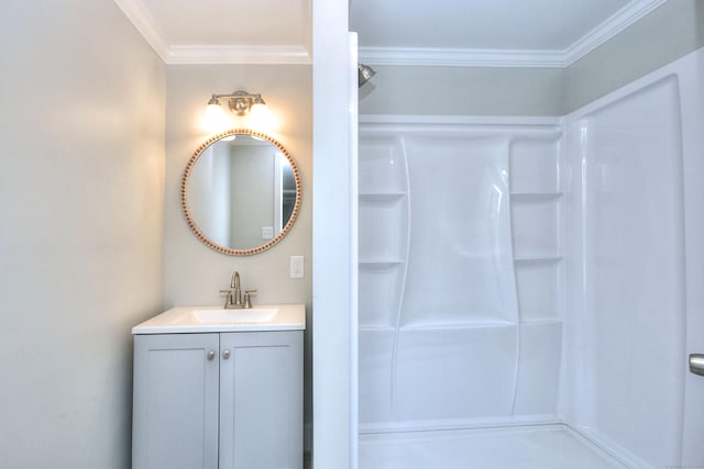 bathroom featuring vanity, ornamental molding, and a shower