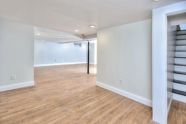 basement featuring light hardwood / wood-style floors