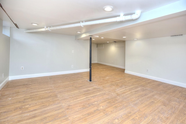 basement featuring light hardwood / wood-style flooring