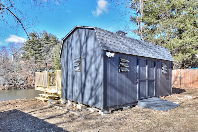 view of outbuilding with a water view