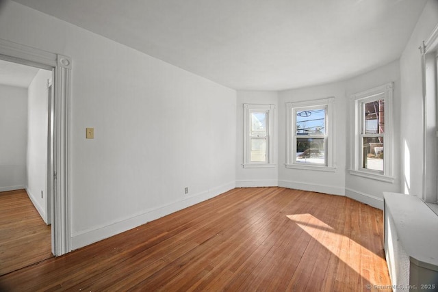 empty room featuring wood-type flooring