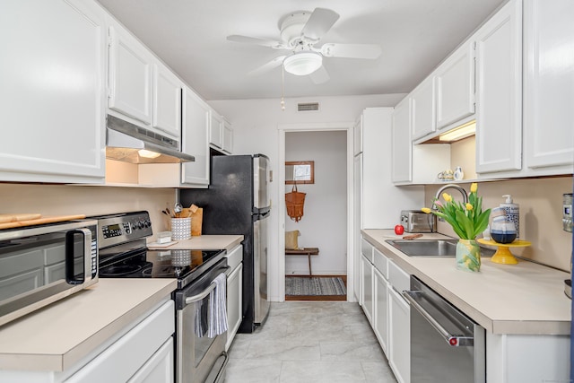 kitchen with sink, ceiling fan, white cabinets, and appliances with stainless steel finishes