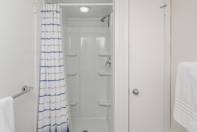 bathroom featuring curtained shower