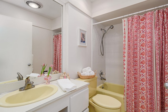 full bathroom featuring vanity, toilet, and shower / bathtub combination with curtain