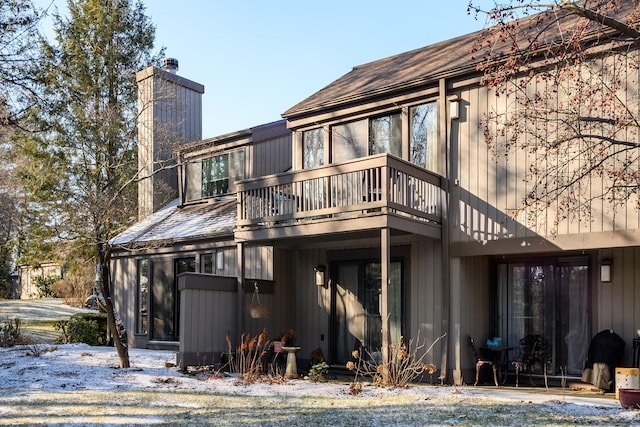 rear view of house featuring a balcony
