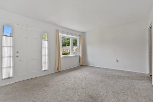 entrance foyer featuring light carpet