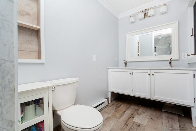 bathroom featuring hardwood / wood-style floors, vanity, a baseboard heating unit, toilet, and crown molding