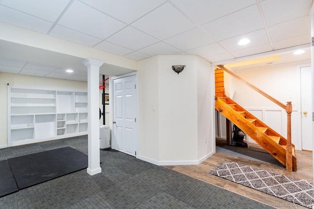 basement with dark hardwood / wood-style flooring