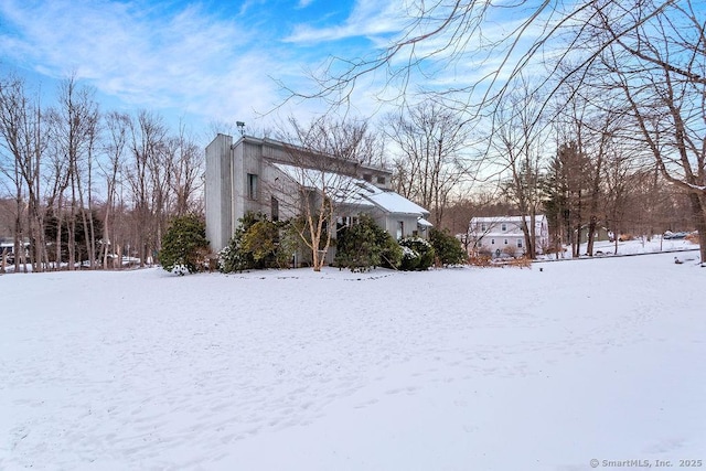 view of snow covered property