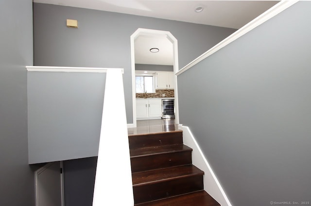 staircase with beverage cooler