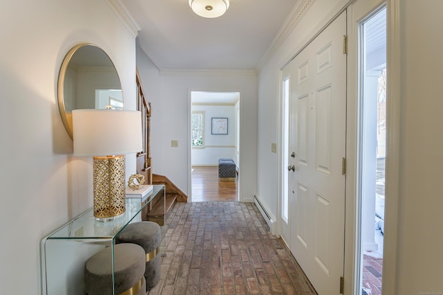 foyer featuring a baseboard radiator and crown molding