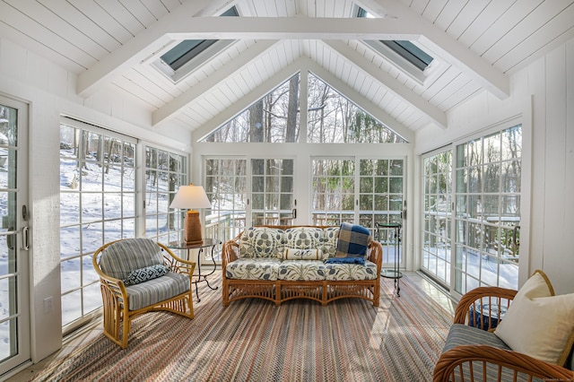 sunroom / solarium featuring lofted ceiling with beams and plenty of natural light