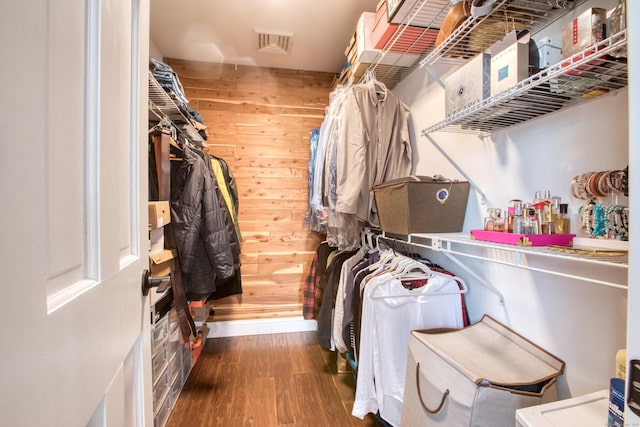 spacious closet featuring visible vents and wood finished floors