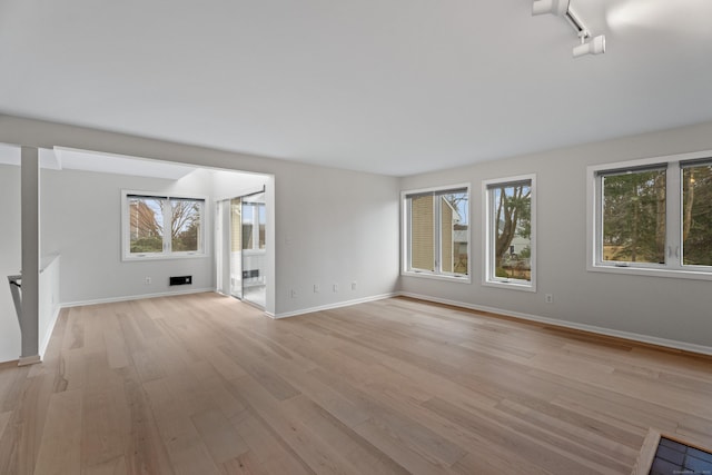 80 Seaview Ter Unit 12, Guilford, CT 06437 - unfurnished living room with light wood finished floors and baseboards