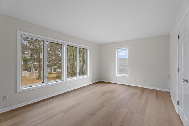 unfurnished room with light hardwood / wood-style flooring