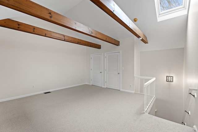 80 Seaview Ter Unit 12, Guilford, CT 06437 - carpeted empty room with beam ceiling, a skylight, and baseboards