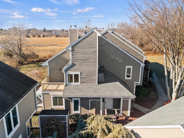 80 Seaview Ter Unit 12, Guilford, CT 06437 - rear view of house featuring a shingled roof and a chimney