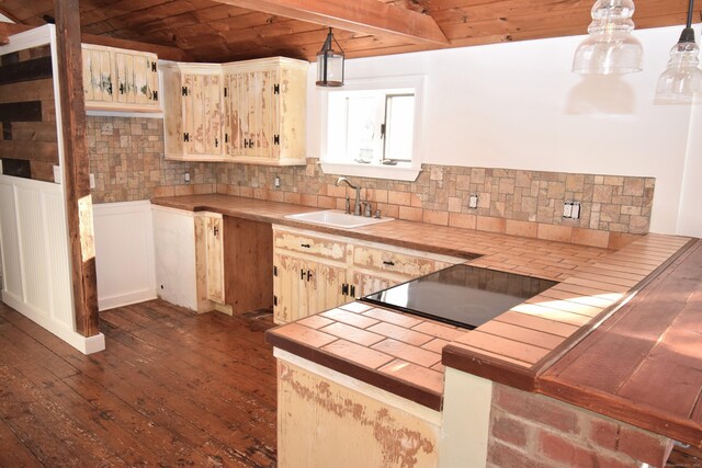 34 Lyme St, Old Lyme, CT 06371 - kitchen featuring a sink, tile counters, backsplash, dark wood-type flooring, and wood ceiling