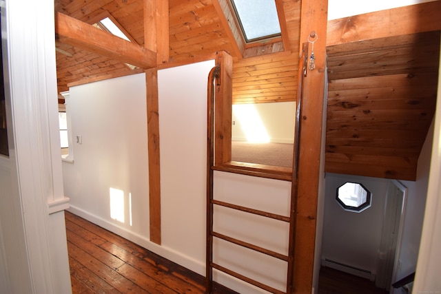 34 Lyme St, Old Lyme, CT 06371 - interior space with a skylight, a baseboard radiator, wood-type flooring, baseboards, and vaulted ceiling