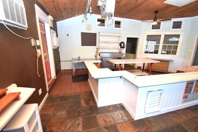 34 Lyme St, Old Lyme, CT 06371 - kitchen with wood ceiling, vaulted ceiling, a wall mounted air conditioner, dark stone finish floors, and ceiling fan