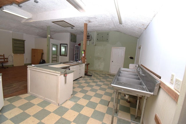 34 Lyme St, Old Lyme, CT 06371 - kitchen with light flooring, lofted ceiling, and a sink