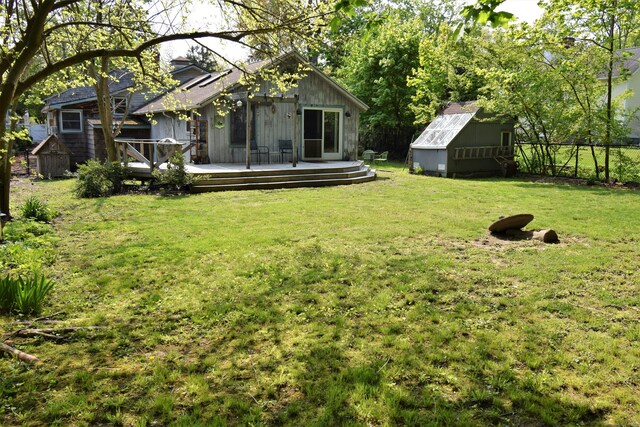 34 Lyme St, Old Lyme, CT 06371 - view of yard featuring a shed, a deck, and an outbuilding