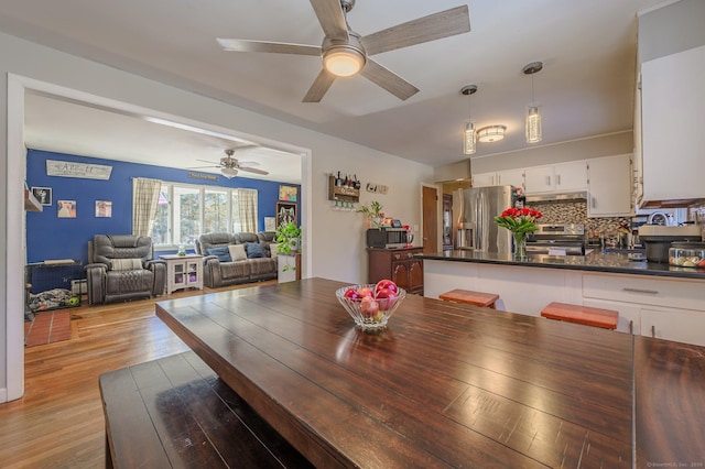 dining space featuring light hardwood / wood-style flooring