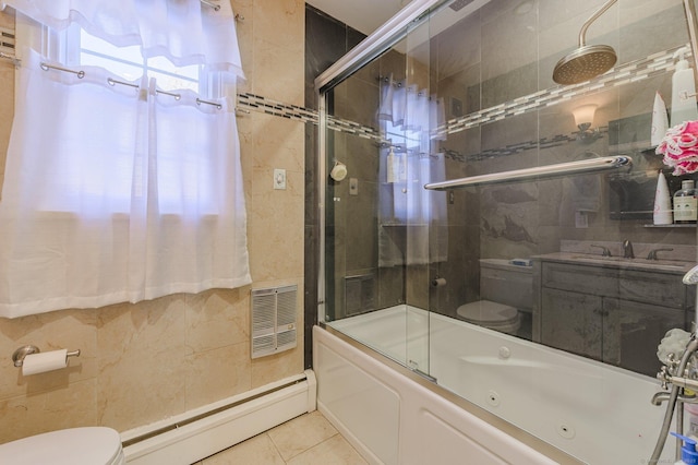 full bathroom featuring sink, tile patterned flooring, bath / shower combo with glass door, a baseboard radiator, and toilet