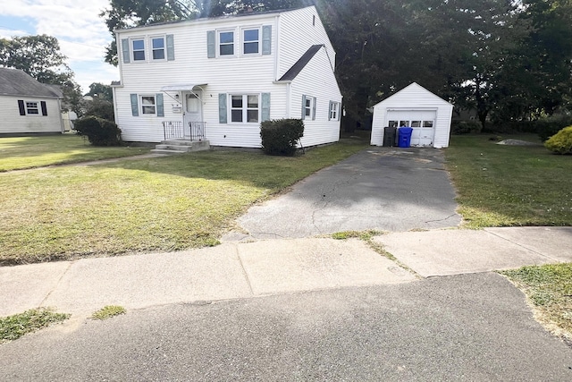 view of front of property with an outbuilding, a garage, and a front lawn