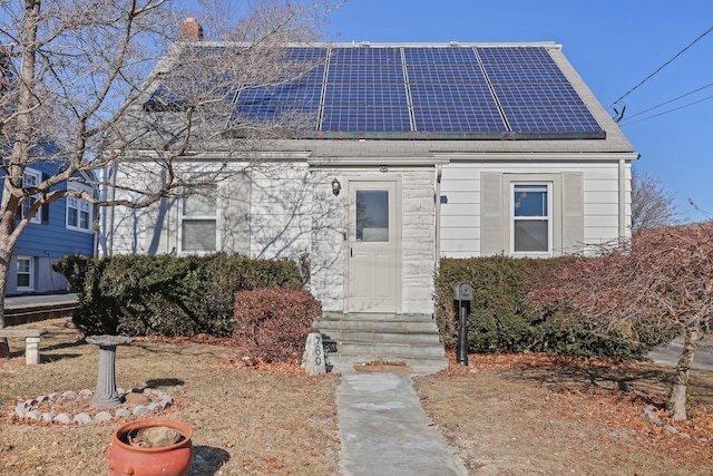 view of front of home with solar panels