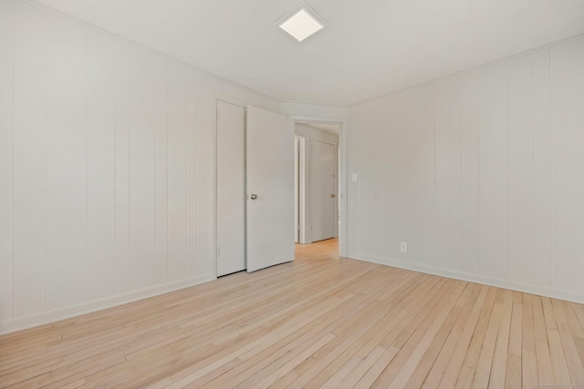 spare room with light hardwood / wood-style floors