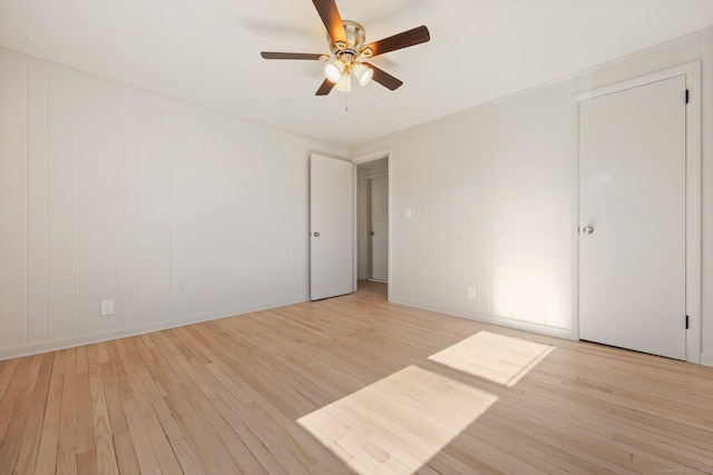 unfurnished room with ceiling fan and light hardwood / wood-style floors