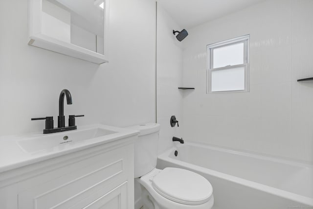 full bathroom with vanity, tiled shower / bath, and toilet