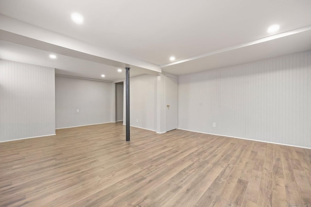 basement featuring light hardwood / wood-style flooring