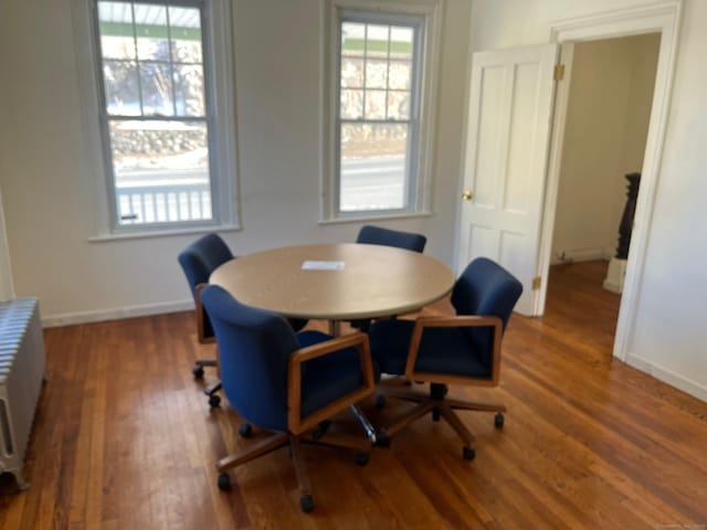 dining space featuring dark hardwood / wood-style floors