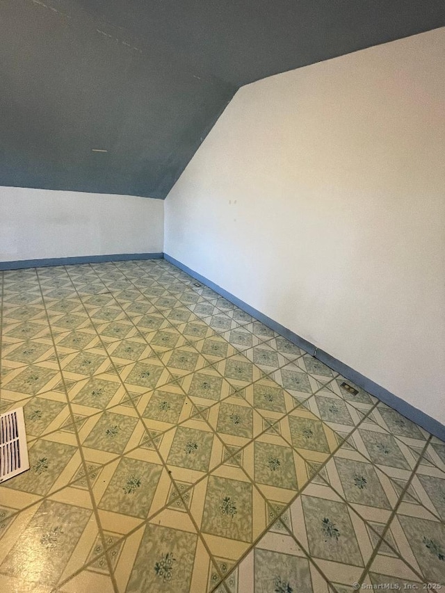 bonus room with vaulted ceiling