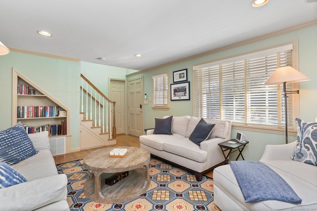 living room featuring crown molding and hardwood / wood-style flooring