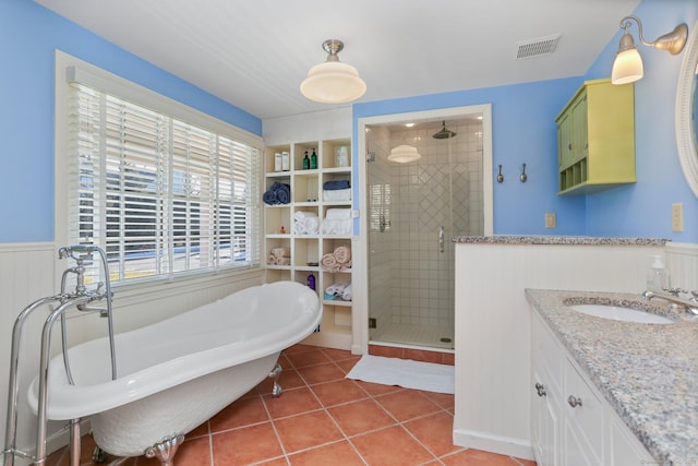 bathroom featuring tile patterned flooring, vanity, and separate shower and tub