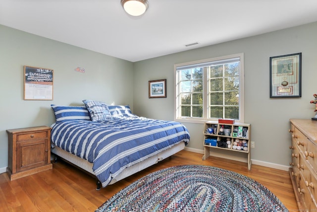 bedroom featuring wood-type flooring