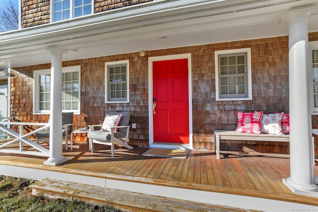 view of exterior entry featuring a porch