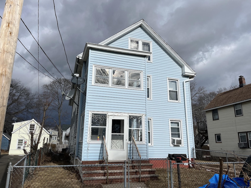 view of front facade featuring cooling unit