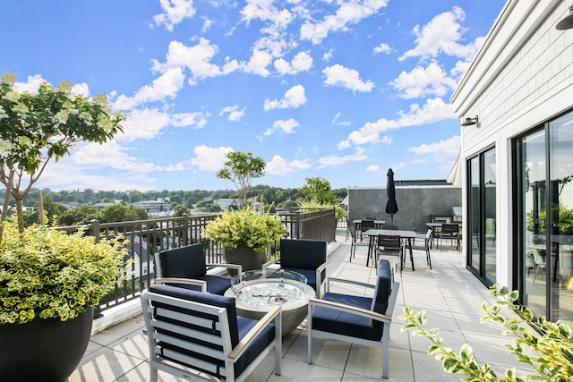 view of patio / terrace featuring a fire pit