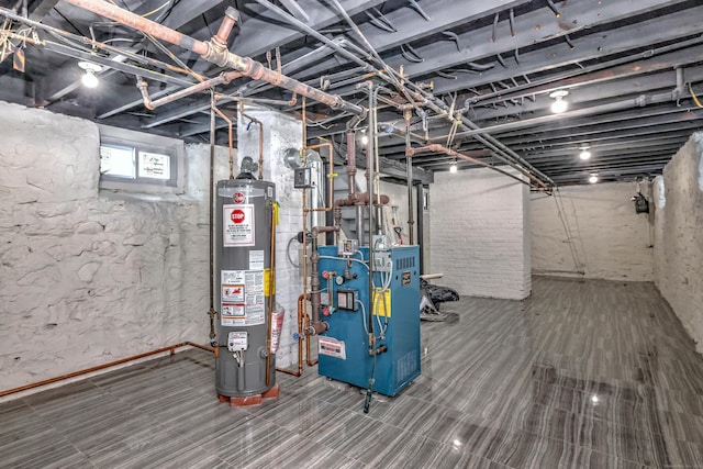 702 King St, Stratford, CT 06614 - below grade area featuring gas water heater and a heating unit