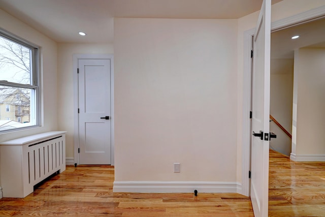 702 King St, Stratford, CT 06614 - unfurnished room with radiator, light wood-style flooring, baseboards, and recessed lighting