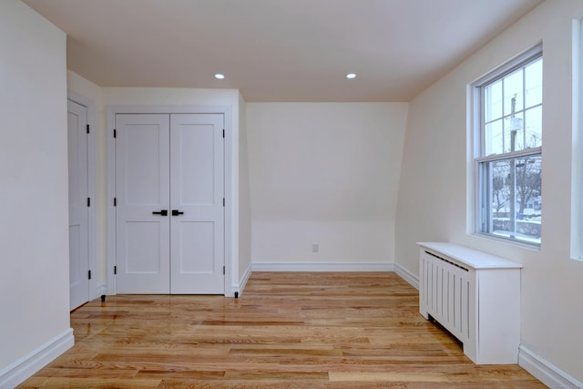 702 King St, Stratford, CT 06614 - unfurnished bedroom with light wood-style flooring, baseboards, and recessed lighting